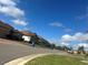 Residential street lined with houses on a sunny day at 1402 Colonial Ct, Winter Haven, FL 33884