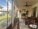 Relaxing sunroom featuring a sectional sofa and window views at 1402 Colonial Ct, Winter Haven, FL 33884