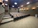 Community theater room with tiered seating and projector at 1402 Colonial Ct, Winter Haven, FL 33884