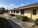 Charming exterior elevation with a welcoming pathway at 16 Kendra Ct # 16, Winter Haven, FL 33880