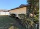 Exterior view showcasing the well-maintained landscaping and side of the home at 16 Kendra Ct # 16, Winter Haven, FL 33880