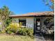 Front exterior of the home with a cozy porch at 16 Kendra Ct # 16, Winter Haven, FL 33880