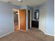 Main bedroom with ensuite vanity area, closet, and open doorway at 16 Kendra Ct # 16, Winter Haven, FL 33880