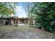 Landscaped backyard with patio and trees at 1891 18Th Nw St, Winter Haven, FL 33881