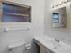 Clean bathroom with white tile, a vanity, and a shower/tub combo at 1891 18Th Nw St, Winter Haven, FL 33881
