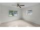 Bright bedroom with ceiling fan and large windows at 1891 18Th Nw St, Winter Haven, FL 33881