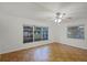 Spacious bedroom with large windows and ceiling fan at 1891 18Th Nw St, Winter Haven, FL 33881