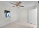 Simple bedroom with ceiling fan and window at 1891 18Th Nw St, Winter Haven, FL 33881