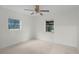 Bedroom with ceiling fan and two windows at 1891 18Th Nw St, Winter Haven, FL 33881