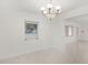 Simple dining room with a chandelier and a view of the backyard at 1891 18Th Nw St, Winter Haven, FL 33881