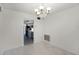 Dining room with a chandelier and view into the kitchen at 1891 18Th Nw St, Winter Haven, FL 33881