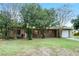Ranch style home with a well-maintained lawn and a spacious driveway at 1891 18Th Nw St, Winter Haven, FL 33881