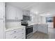 Modern kitchen with stainless steel appliances and marble countertops at 1891 18Th Nw St, Winter Haven, FL 33881