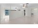 Open living space with a partial wall and ceiling fans at 1891 18Th Nw St, Winter Haven, FL 33881