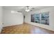 Living room with brick accent wall and parquet flooring at 1891 18Th Nw St, Winter Haven, FL 33881