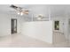 Open living area with terrazzo floors and a partial wall at 1891 18Th Nw St, Winter Haven, FL 33881