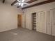 Spacious bedroom with carpet, built-in closet, ceiling fan, and exposed beams at 1988 13Th Nw St, Winter Haven, FL 33881