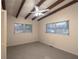 Bright bedroom with ceiling fan, multiple windows, and carpeted flooring at 1988 13Th Nw St, Winter Haven, FL 33881