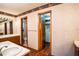 View of the bathroom's double vanity, toilet, and walk-in closet at 218 College Grove Ne Cir, Winter Haven, FL 33881
