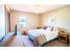 Bedroom with a bed, wicker furniture, and a TV at 218 College Grove Ne Cir, Winter Haven, FL 33881