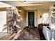 Inviting front entryway with a stone accent wall and a covered walkway at 218 College Grove Ne Cir, Winter Haven, FL 33881
