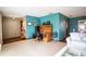 Living room with designated office space, wood floors, and tile flooring at 218 College Grove Ne Cir, Winter Haven, FL 33881