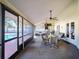 Screened-in patio with seating area overlooking the in-ground pool at 218 College Grove Ne Cir, Winter Haven, FL 33881