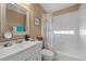 Bathroom featuring white vanity, shower/tub combo, and decorative shower curtain at 221 Prather Dr, Davenport, FL 33837