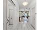 Tiled entryway with view of the combined living and dining areas through open doorway at 221 Prather Dr, Davenport, FL 33837