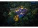 Night aerial view of house, pool, and lush landscaping at 2300 N Scenic Hwy # 104, Lake Wales, FL 33898