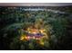 Night-time aerial view showcasing a home's elegant architecture and expansive property at 2300 N Scenic Hwy # 104, Lake Wales, FL 33898