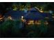 Night aerial view of house, pool, and lush landscaping at 2300 N Scenic Hwy # 104, Lake Wales, FL 33898