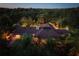 Night aerial view of house, pool, and lush landscaping at 2300 N Scenic Hwy # 104, Lake Wales, FL 33898