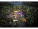 Night aerial view of house, pool, and lush landscaping at 2300 N Scenic Hwy # 104, Lake Wales, FL 33898