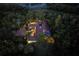 Night aerial view of house, pool, and lush landscaping at 2300 N Scenic Hwy # 104, Lake Wales, FL 33898