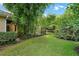 Landscaped backyard with bamboo and fruit trees at 2300 N Scenic Hwy # 104, Lake Wales, FL 33898