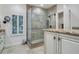 Large bathroom with a glass shower, granite countertop, and white cabinets at 2300 N Scenic Hwy # 104, Lake Wales, FL 33898