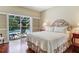 Bedroom with pool view, and toile print bedding at 2300 N Scenic Hwy # 104, Lake Wales, FL 33898