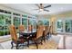 Elegant dining room with large table, leather chairs, and garden views at 2300 N Scenic Hwy # 104, Lake Wales, FL 33898
