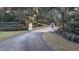 Elegant driveway entrance with landscaping and lighting at 2300 N Scenic Hwy # 104, Lake Wales, FL 33898