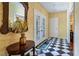 Bright entryway featuring a decorative mirror and table at 2300 N Scenic Hwy # 104, Lake Wales, FL 33898