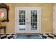Elegant entryway with French doors and checkered floor at 2300 N Scenic Hwy # 104, Lake Wales, FL 33898