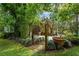 Landscaped garden path with bamboo and large pot at 2300 N Scenic Hwy # 104, Lake Wales, FL 33898
