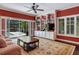 Gathering room with built-in shelving, TV, and access to pool at 2300 N Scenic Hwy # 104, Lake Wales, FL 33898