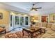 Gathering room boasts a fireplace, built-ins and access to patio at 2300 N Scenic Hwy # 104, Lake Wales, FL 33898