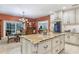 Gourmet kitchen features granite island, custom cabinetry, and breakfast bar at 2300 N Scenic Hwy # 104, Lake Wales, FL 33898