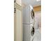 Laundry room with stackable washer and dryer, plus extra cabinet space at 2300 N Scenic Hwy # 104, Lake Wales, FL 33898