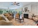 Bright living room with hardwood floors, fireplace, and built-in shelving at 2300 N Scenic Hwy # 104, Lake Wales, FL 33898