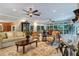 Bright living room with hardwood floors, fireplace, and access to sunroom at 2300 N Scenic Hwy # 104, Lake Wales, FL 33898