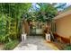 Charming patio entrance with lush bamboo and flowering vines at 2300 N Scenic Hwy # 104, Lake Wales, FL 33898